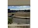 View of community common area from a beautiful porch with seating and landscaping at 149 Greenbelt Ct, Summerville, SC 29485