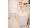 Bright laundry room with tile floors, washer, dryer, and overhead shelving at 149 Greenbelt Ct, Summerville, SC 29485