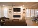 Spacious living room featuring an electric fireplace, mounted TV, and wood floors at 149 Greenbelt Ct, Summerville, SC 29485