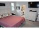 Comfortable main bedroom featuring a dresser and view into the bathroom at 149 Greenbelt Ct, Summerville, SC 29485
