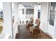 Charming porch with two wooden rocking chairs and bright decorative pillows at 149 Greenbelt Ct, Summerville, SC 29485