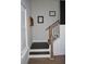 Staircase with wood railing and a window for natural light at 149 Greenbelt Ct, Summerville, SC 29485