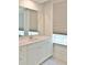 Bright bathroom featuring white cabinets, a modern sink, large mirror, and a window at 1510 Cecile St, Mount Pleasant, SC 29464