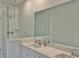 Bathroom featuring a shower, double sinks and a large mirror at 1510 Cecile St, Mount Pleasant, SC 29464