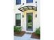 A stylish front entrance highlighting a gray door with awning, modern lighting, and manicured landscaping, creating curb appeal at 1510 Cecile St, Mount Pleasant, SC 29464