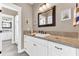 Bathroom with white cabinetry, granite counters, and a framed mirror with tiled backsplash at 1626 Bull Creek Ln, Charleston, SC 29414
