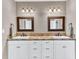 Bathroom vanity with dual sinks, stylish mirrors, and bronze plumbing fixtures at 1626 Bull Creek Ln, Charleston, SC 29414