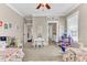 Bright bedroom featuring playful decor, a shared table, and two cozy twin beds with patterned bedding at 1626 Bull Creek Ln, Charleston, SC 29414