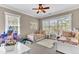 Charming bedroom with two twin beds, colorful decor, and plenty of natural light from large windows at 1626 Bull Creek Ln, Charleston, SC 29414
