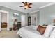 Inviting bedroom with a bed, desk, and windows providing natural light; perfect for relaxation and productivity at 1626 Bull Creek Ln, Charleston, SC 29414