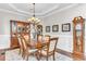 Elegant dining room featuring hardwood floors, chandelier, decorative rug, and china cabinet at 1626 Bull Creek Ln, Charleston, SC 29414