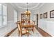 Formal dining room with hardwood floors, decorative rug, chandelier, and china cabinet at 1626 Bull Creek Ln, Charleston, SC 29414