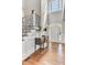 Welcoming foyer with hardwood floors, console table, staircase, and natural light at 1626 Bull Creek Ln, Charleston, SC 29414