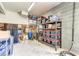 Spacious garage featuring ample storage shelves and cinder block walls at 1626 Bull Creek Ln, Charleston, SC 29414
