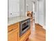 Kitchen island featuring storage cabinets, and a stainless steel built-in microwave at 1626 Bull Creek Ln, Charleston, SC 29414