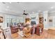 Open-concept living room with fireplace, modern furnishings, and plenty of natural light at 1626 Bull Creek Ln, Charleston, SC 29414