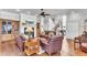 Inviting living room features a fireplace, custom bookshelves, hardwood floors and comfortable leather seating at 1626 Bull Creek Ln, Charleston, SC 29414