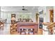 Cozy living room with hardwood floors, fireplace, ceiling fan and comfortable leather furniture at 1626 Bull Creek Ln, Charleston, SC 29414