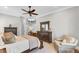 Spacious main bedroom features neutral walls, ceiling fan, TV, and handsome furniture set at 1626 Bull Creek Ln, Charleston, SC 29414