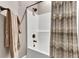 Shower with bronze fixtures and vertical striped shower curtain at 1626 Bull Creek Ln, Charleston, SC 29414