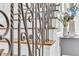 Detail of the staircase shows the ornate metal railings and hardwood treads at 1626 Bull Creek Ln, Charleston, SC 29414