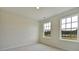 Bright bedroom with two windows offering natural light, neutral walls, and carpeted flooring at 197 Belfort Pl, Summerville, SC 29486