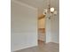 Elegant dining area with wainscotting, with a light fixture and view into the kitchen for open concept feel at 197 Belfort Pl, Summerville, SC 29486