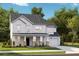 Charming two-story home featuring a welcoming front porch, attached garage, and traditional architectural details at 197 Belfort Pl, Summerville, SC 29486