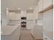 Bright kitchen with white cabinets, stainless steel appliances, and quartz countertops for a modern feel at 197 Belfort Pl, Summerville, SC 29486