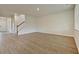 Open concept living area leads to a staircase, featuring durable flooring and abundant natural light at 197 Belfort Pl, Summerville, SC 29486