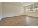 Spacious living room with wood-look flooring, natural light, and ample space for comfortable seating at 197 Belfort Pl, Summerville, SC 29486