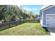 Fenced backyard with well-maintained lawn and privacy fencing, ideal for outdoor activities at 1984 Shadetree Blvd, Johns Island, SC 29455