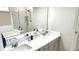 Modern bathroom with double vanity, granite counters, a large mirror, and a glass-enclosed shower at 1984 Shadetree Blvd, Johns Island, SC 29455