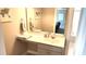 Bathroom vanity with a mirror and a towel rack; the entrance to the tub is through the door to the right at 1984 Shadetree Blvd, Johns Island, SC 29455