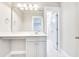Bright bathroom vanity with a large mirror and marble floors, plus a door to the toilet at 1984 Shadetree Blvd, Johns Island, SC 29455