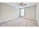 Bright bedroom featuring neutral walls, plush carpet, a ceiling fan, and a window at 1984 Shadetree Blvd, Johns Island, SC 29455