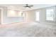 Spacious carpeted bonus room with natural light, perfect for a playroom or additional living space at 1984 Shadetree Blvd, Johns Island, SC 29455