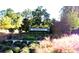 Oakfield community entrance sign surrounded by manicured flowerbeds, shrubs, and ornamental grasses at 1984 Shadetree Blvd, Johns Island, SC 29455