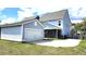 Backyard view of a home with a detached garage and a screened-in porch at 1984 Shadetree Blvd, Johns Island, SC 29455