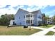 Charming two-story home with a quaint double porch on a sunny corner lot at 1984 Shadetree Blvd, Johns Island, SC 29455