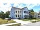 Charming two-story home with double porches, light blue siding, black shutters and a well manicured lawn at 1984 Shadetree Blvd, Johns Island, SC 29455
