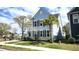 Charming two-story home with a quaint double porch on a sunny corner lot at 1984 Shadetree Blvd, Johns Island, SC 29455