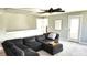 Upstairs living room with a large sectional couch and ceiling fan for relaxation and entertainment at 1984 Shadetree Blvd, Johns Island, SC 29455