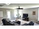 Upstairs living room with a large sectional couch and ceiling fan for relaxation and entertainment at 1984 Shadetree Blvd, Johns Island, SC 29455