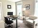 Cozy home office with black desk, black chair, a lamp, and an accent chair at 1984 Shadetree Blvd, Johns Island, SC 29455