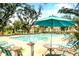 Enjoy the community pool with lounge chairs and shady umbrellas on a sunny day at 1984 Shadetree Blvd, Johns Island, SC 29455