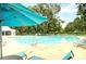 Enjoy the community pool with lounge chairs and shady umbrellas on a sunny day at 1984 Shadetree Blvd, Johns Island, SC 29455