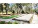 Community amenities with a putting green, bocce ball court, and benches for relaxation at 1984 Shadetree Blvd, Johns Island, SC 29455
