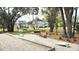 Community park featuring a putting green, bocce ball court, benches, and trees at 1984 Shadetree Blvd, Johns Island, SC 29455