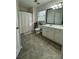 Bright bathroom featuring a shower-tub combo, large vanity, and stylish tile floors at 203 Arbor Oaks Dr, Summerville, SC 29485